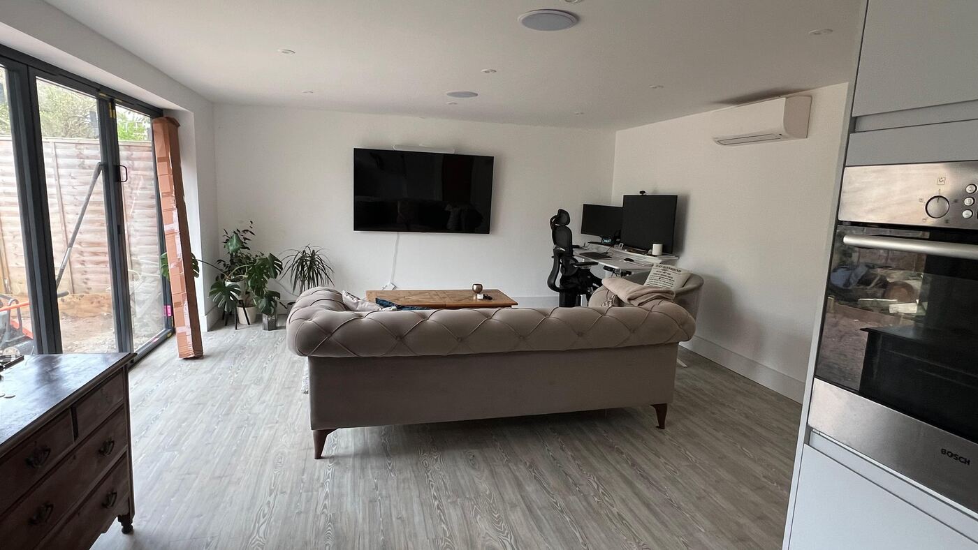 Living room with bifold doors, downlights and ceiling speakers
